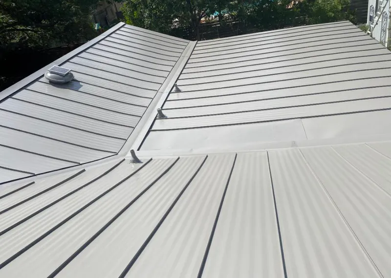 Solar attic fan installed on a metal roof for Roof Ventilation in Dormont